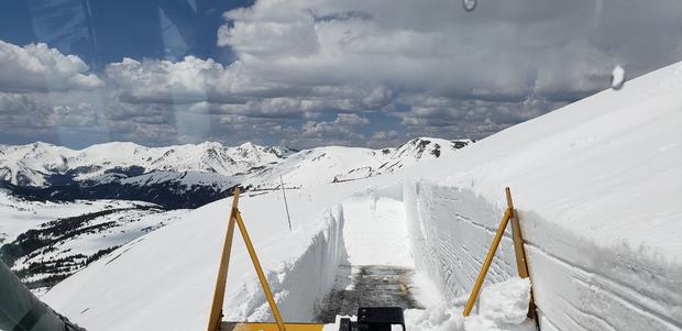 RMNP snowplow operator plowing near Gore Range Overlook May 14, 2019 Mountain Range In View Is the Never Summer Mountains Courtesy Rocky Mountain National Park 