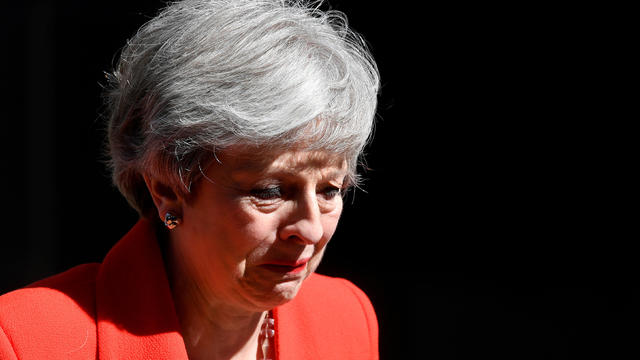 British Prime Minister Theresa May reacts as she delivers a statement in London 
