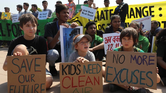 Children take part in a global protest against climate change in New Delhi 