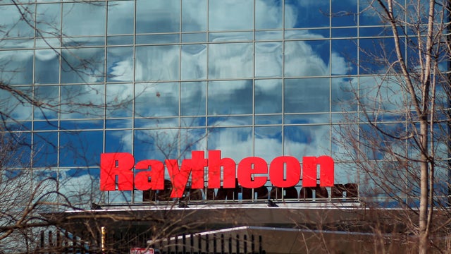FILE PHOTO: A sign marks the Raytheon offices in Woburn 