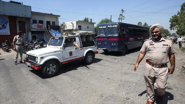 A police bus carrying the men accused of rape and murder of an eight-year-old girl in Kathua, near Jammu, arrives at a court in Pathankot 