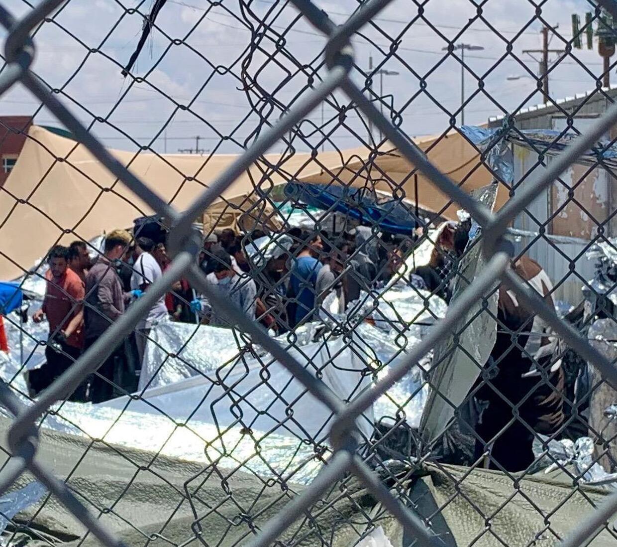 Migrants being held outdoors near bridge in El Paso, official says ...