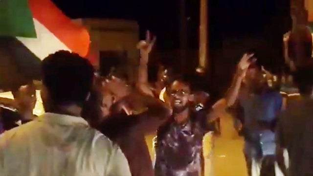 People celebrate in Omdurman 
