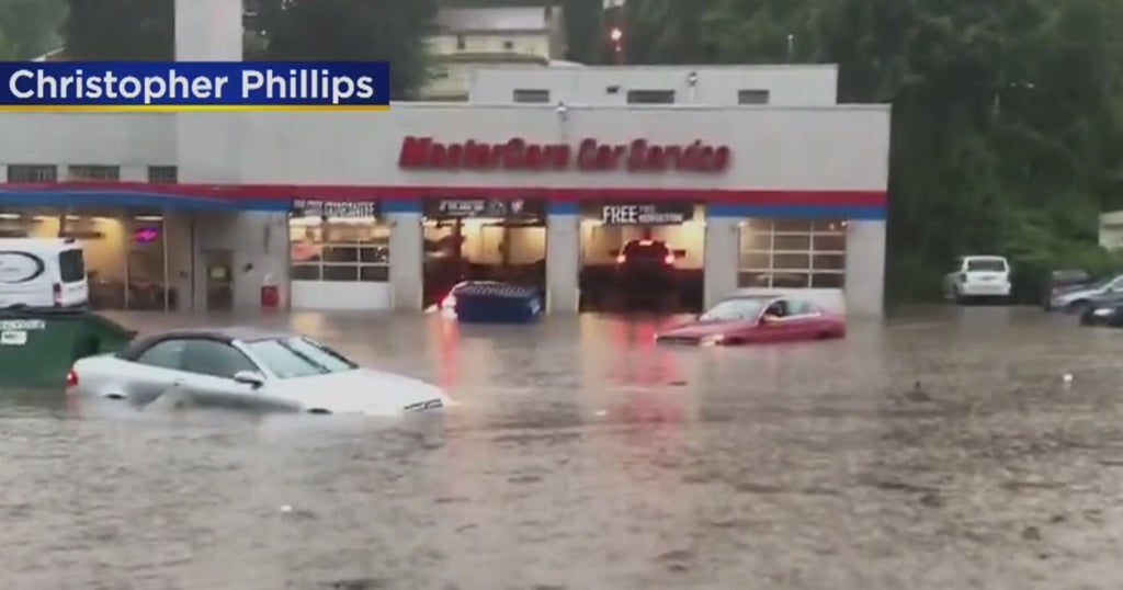 Two Men Rescue Driver Of Car Swept Up In Flooding On Banksville Road