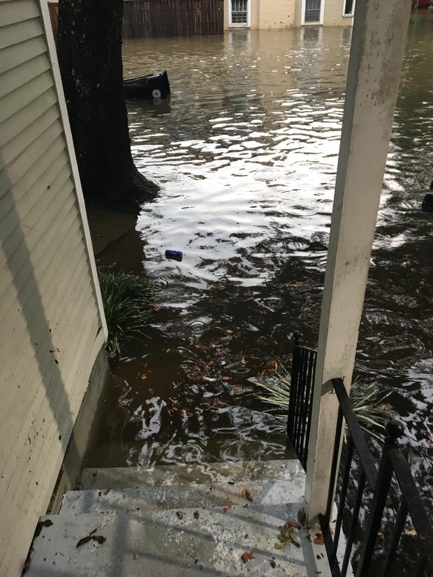 Flooding reaches the steps of a home in New Orleans near Tulane University 