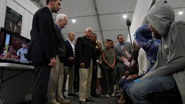 U.S. Vice President Mike Pence talks to young asylum-seekers at the Donna Soft-Sided Processing Facility in Donna 