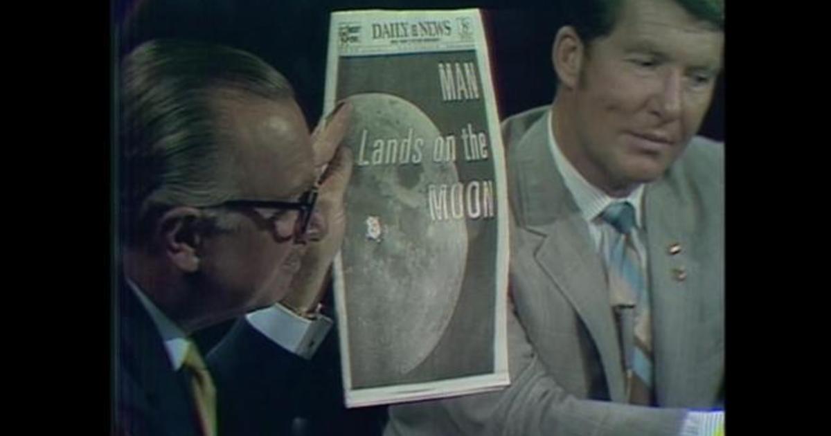 Walter Cronkite Shows Front Page Headlines About Moon Landing Cbs News