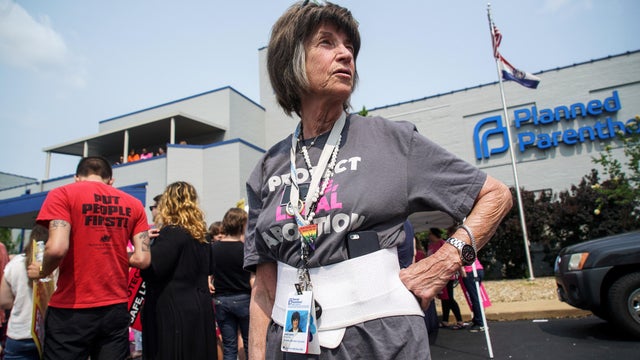 A 20-year employee of Planned Parenthood waits for a rally to start after a judge granted a temporary restraining order on the closing of Missouri's sole remaining Planned Parenthood clinic in St. Louis 