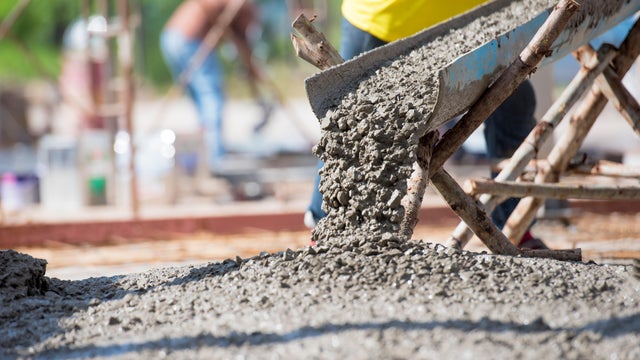 Concrete pouring during commercial concreting floors of building 