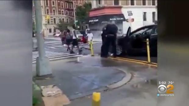 NYPD officers doused with water 