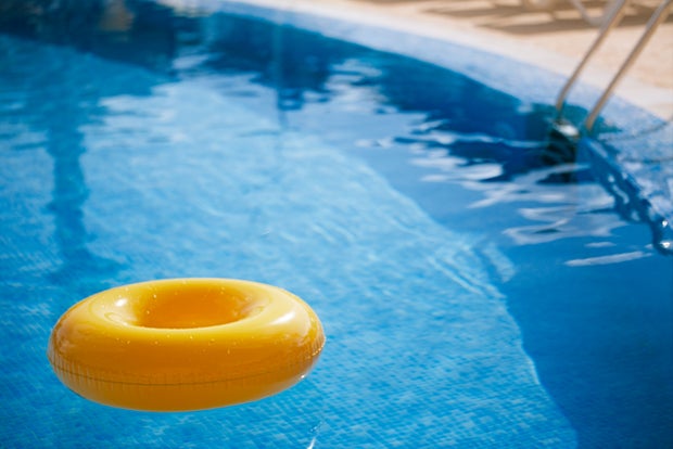 floating ring on blue water swimpool 