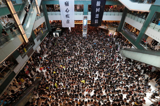Demonstrators attend a rally to support the city-wide strike and to call for democratic reforms at New Town Plaza shopping mall in Hong Kong 