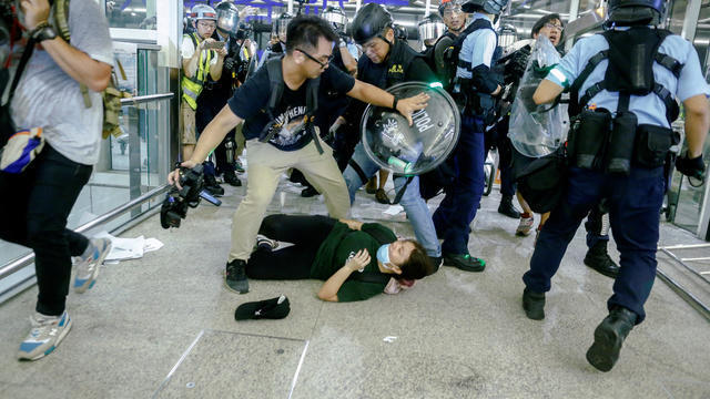 cbsn-fusion-hong-kong-protesters-fear-military-crackdown-after-violence-at-airport-demonstrations-thumbnail.jpg 