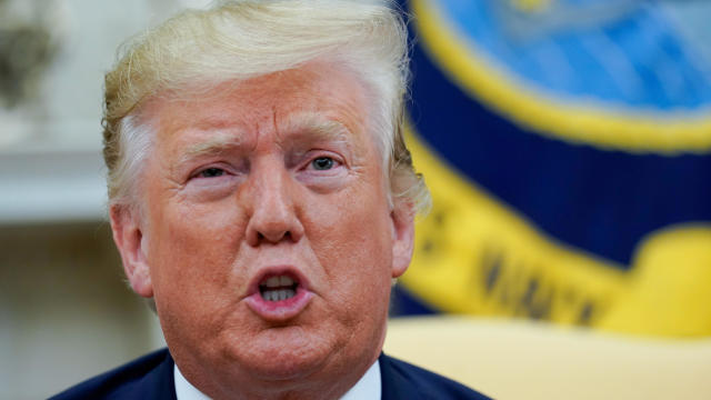 U.S. President Donald Trump answers reporters questions in the Oval office of the White House In Washington 