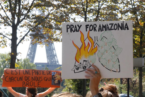 Youth for Climate demonstrators attend a protest outside the Brazil's embassy in Paris due the wildfires at Amazon rainforest 