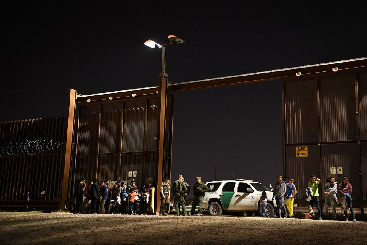 Migrant families turn themselves to U.S. Border Patrol to seek asylum after illegally crossing the Rio Grande in Hidalgo 