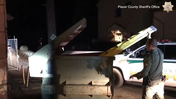 Another deputy then lowered a ladder into the dumpster. (Credit: Placer County Sheriff's Office) 