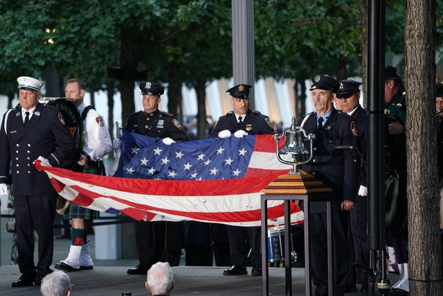 Flag-bearers take part in the September 11 commemoration ceremony at the 9/11 Memorial and Museum at the World Trade Center on September 11, 2019, in New York. 