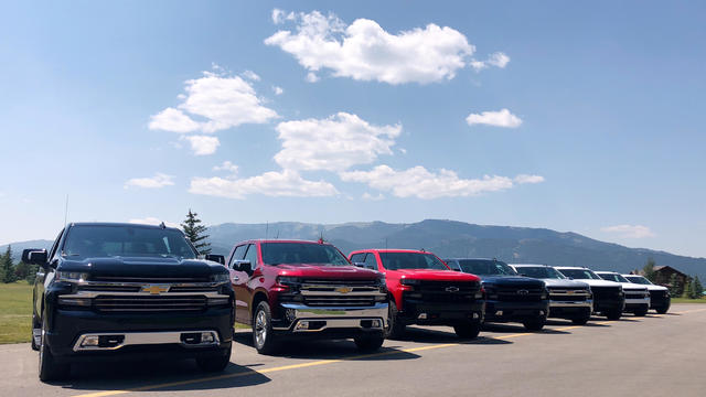 FILE PHOTO: Eight versions of General Motors CO’s new generation Chevrolet Silverado pickups are pictured lined up at an event near Alpine 