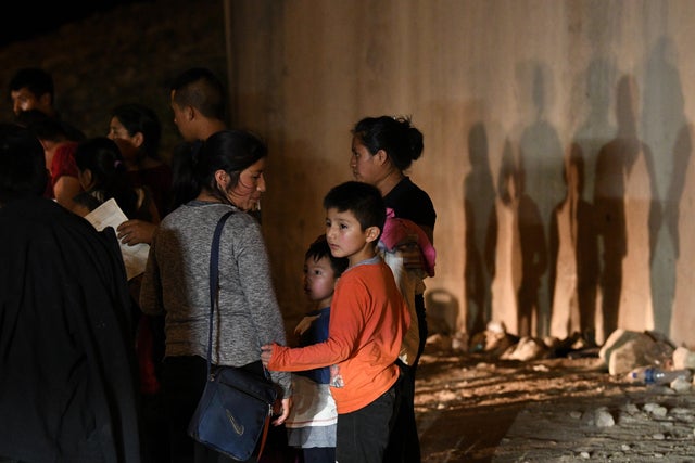 Migrant families turn themselves to U.S. Border Patrol to seek asylum following an illegal crossing of the Rio Grande in Hidalgo 