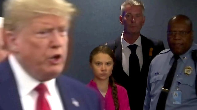 Swedish environmental activist Greta Thunberg watches as U.S. President Donald Trump enters the United Nations 