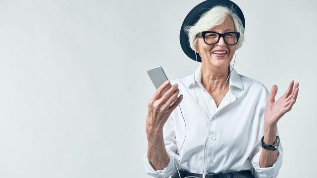 Portrait of elderly woman in hipster clothes 