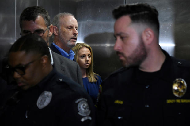 Amber Guyger, who is charged in the killing of Botham Jean in his own home, arrives on the first day of the trial in Dallas 