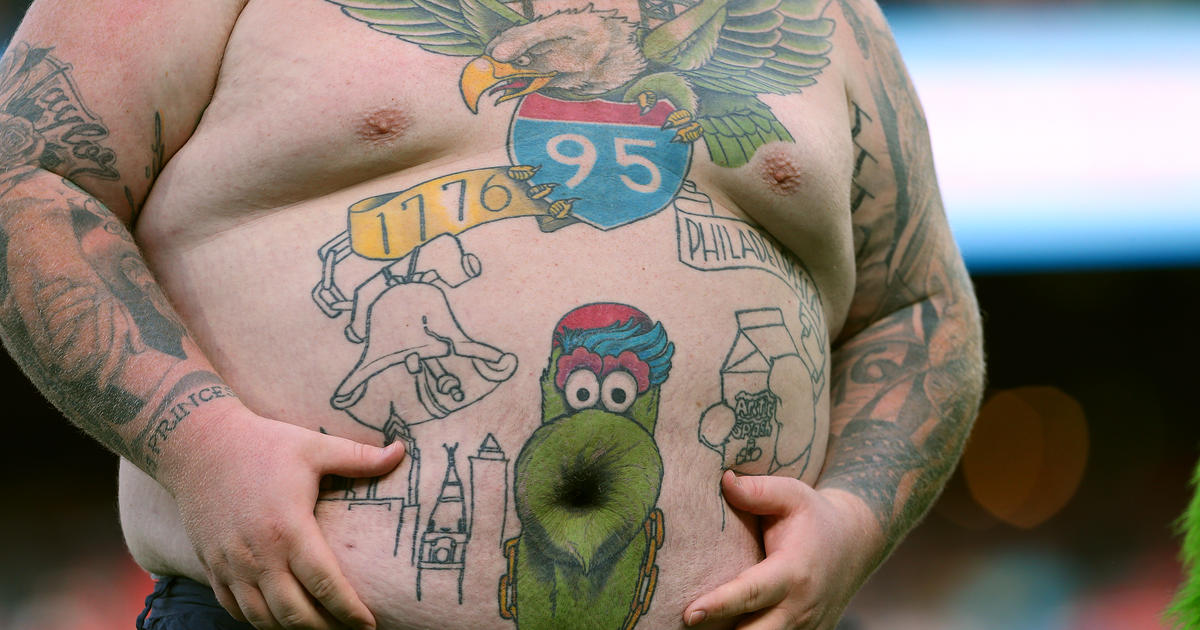WATCH: Viral Eagles Fan With Phillie Phanatic Belly Button Tattoo Has  Dance-off With Phanatic - CBS Philadelphia