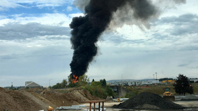 Smoke rises from where a B-17 plane crashed at Bradley International Airport north of Hartford, Connecticut, October 2, 2019. 