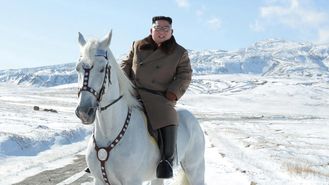 North Korean leader Kim Jong Un rides a horse during snowfall in Mount Paektu 