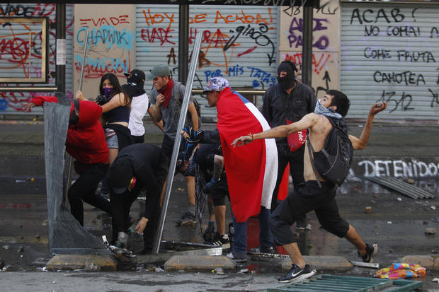Protests Continue In Chile After President Piñera Declared State of Emergency And Suspended Subway Fare Hike 