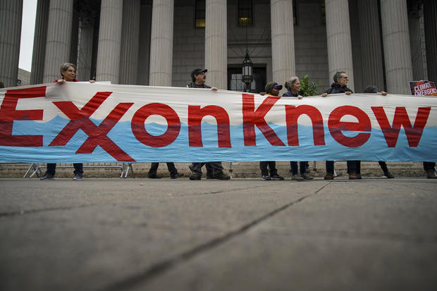 Environmental Activists Protest Outside Exxon Fraud Trial 