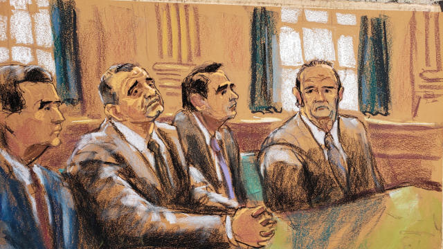 Ukrainian-American businessman Lev Parnas and Russian-born businessman Igor Fruman sit with their lawyers 