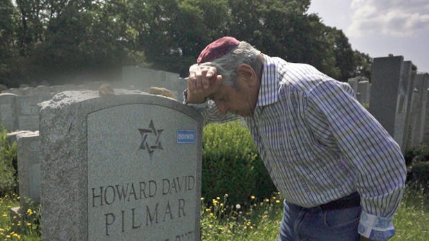 Frank Pilmar at son's grave 
