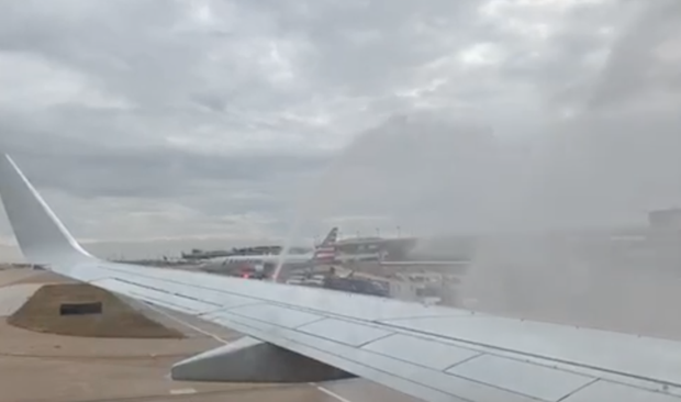 View of water cannon salute from inside plane 