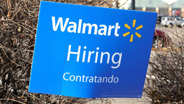 A sign seeking workers is seen at a Walmart store in Westminster 