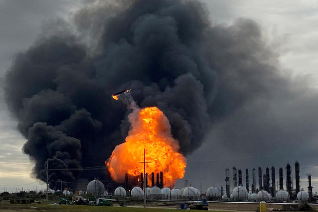 FILE PHOTO: A process tower flies through air after exploding at the TPC Group Petrochemical Plant in Port Neches 