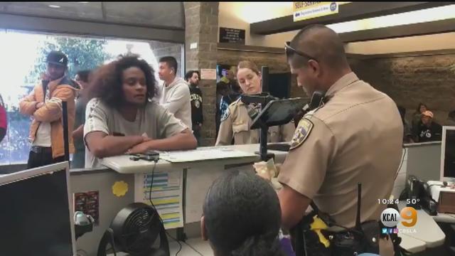 CHP-Officer-Helps-Woman.jpg 