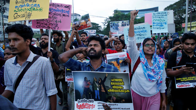 Demonstrators shout slogans during a protest march to show solidarity with the students of New Delhi's Jamia Millia Islamia university, in Kochi 