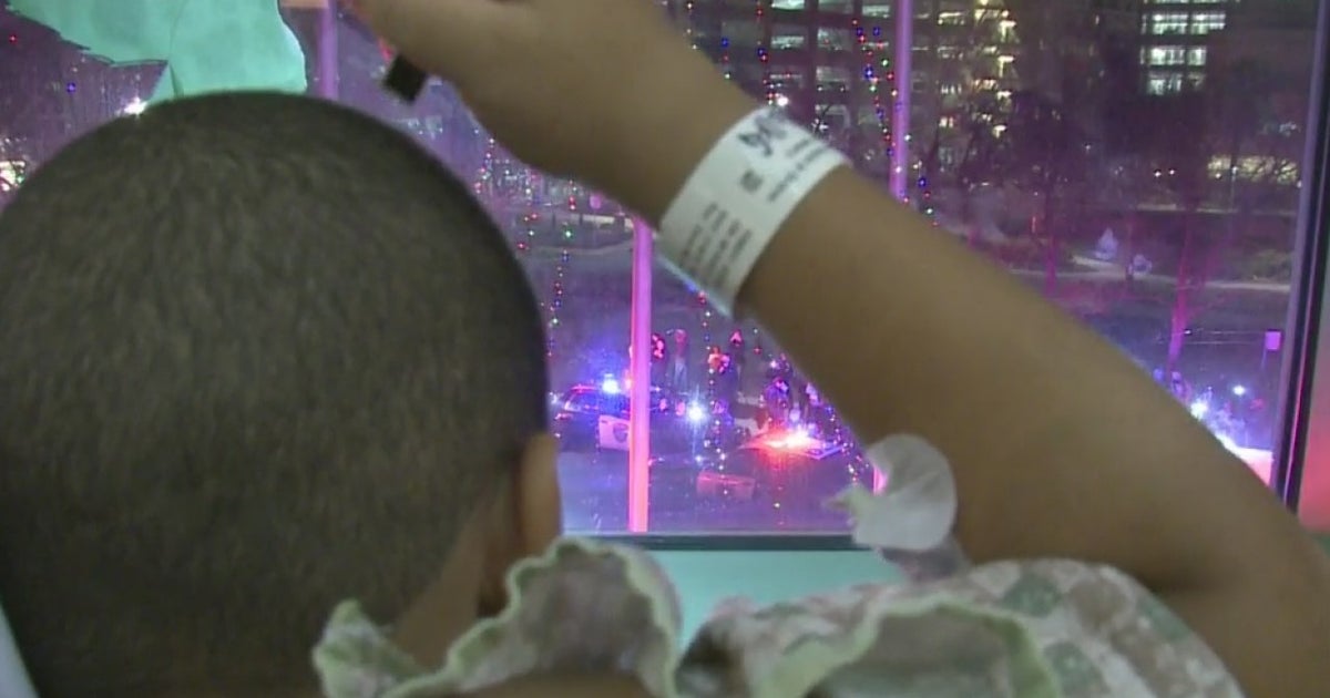 First Responders Light Up Parking Lot Outside Shriners Hospital To