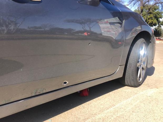 Bullet holes in car 