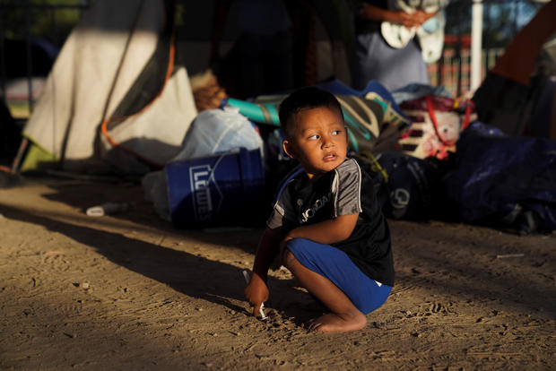 An asylum-seeking child plays in an encampment where he lives in Matamoros 