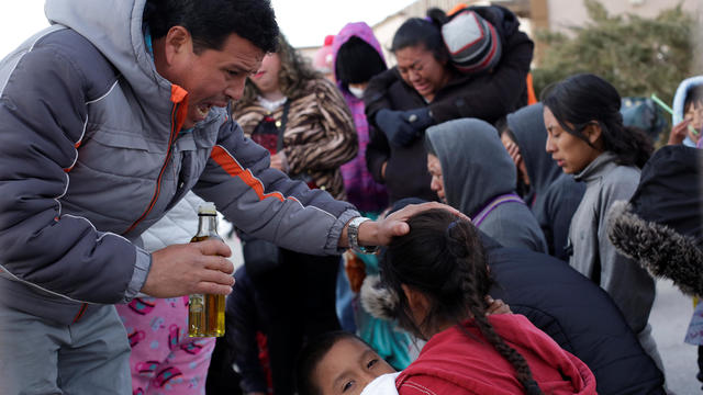 Migrants pray at the government-run Leona Vicario migrant shelter, temporarily closed by health authorities following a varicela outbreak between Central American migrants, in Ciudad Juarez 