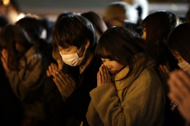 People offer their New Year's prayers at the Meiji Jingu Shinto shrine on New Year's Day 2020 in Tokyo. 