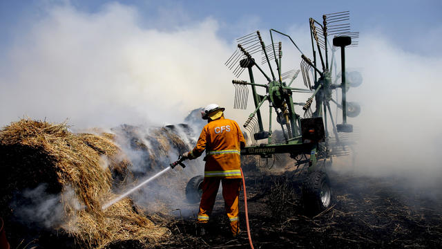 Country Fire Service (CFS) members put out a fire which reached hay bales on a property at Mount Torrens in the Adelaide Hills 