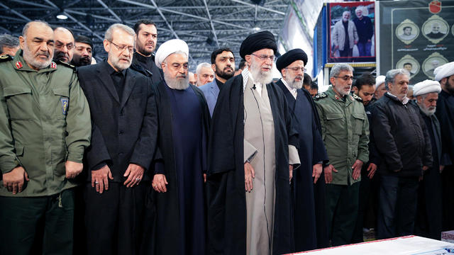 Iran's Supreme Leader Khamenei and President Rouhani pray near the coffin of Iranian Major-General Qassem Soleimani in Tehran 