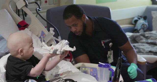 Children's hospital housekeeper connects two patients who are in isolation CBS News