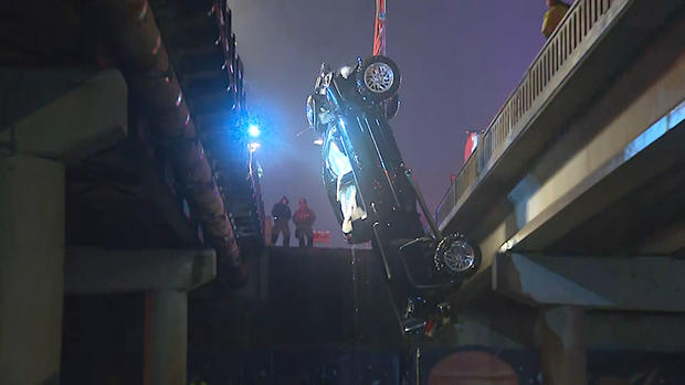 truck over bridge into Trinity River 