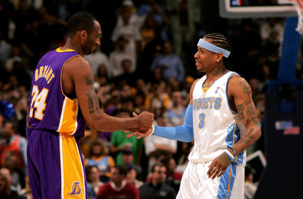 Kobe Bryant, No. 24 of the Los Angeles Lakers, and Allen Iverson, No. 3 of the Denver Nuggets, greet each other before tip-off at the Pepsi Center on March 15, 2007, in Denver, Colorado. 