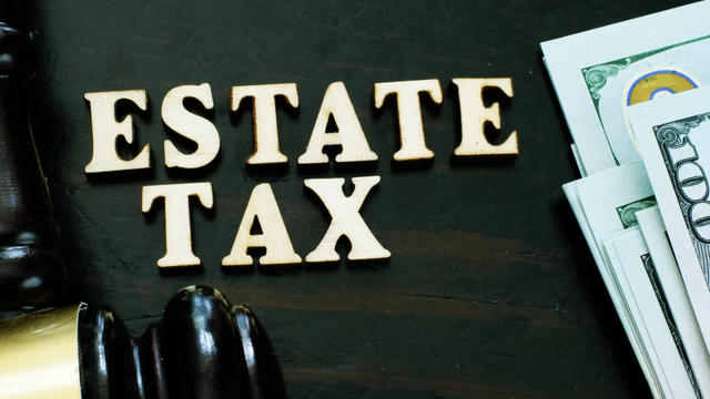 Estate tax from wooden letters and gavel. 
